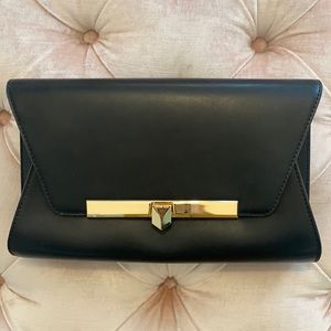 Michael Kors black and gold clutch